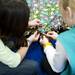 Girl Scout Troop 40112 work on blankets to send to the New Hope Baptist Church in Newark, New Jersey on Tuesday, Jan. 22. The troop received a discount on materials from Jo-Ann Fabric and Craft. Daniel Brenner I AnnArbor.com